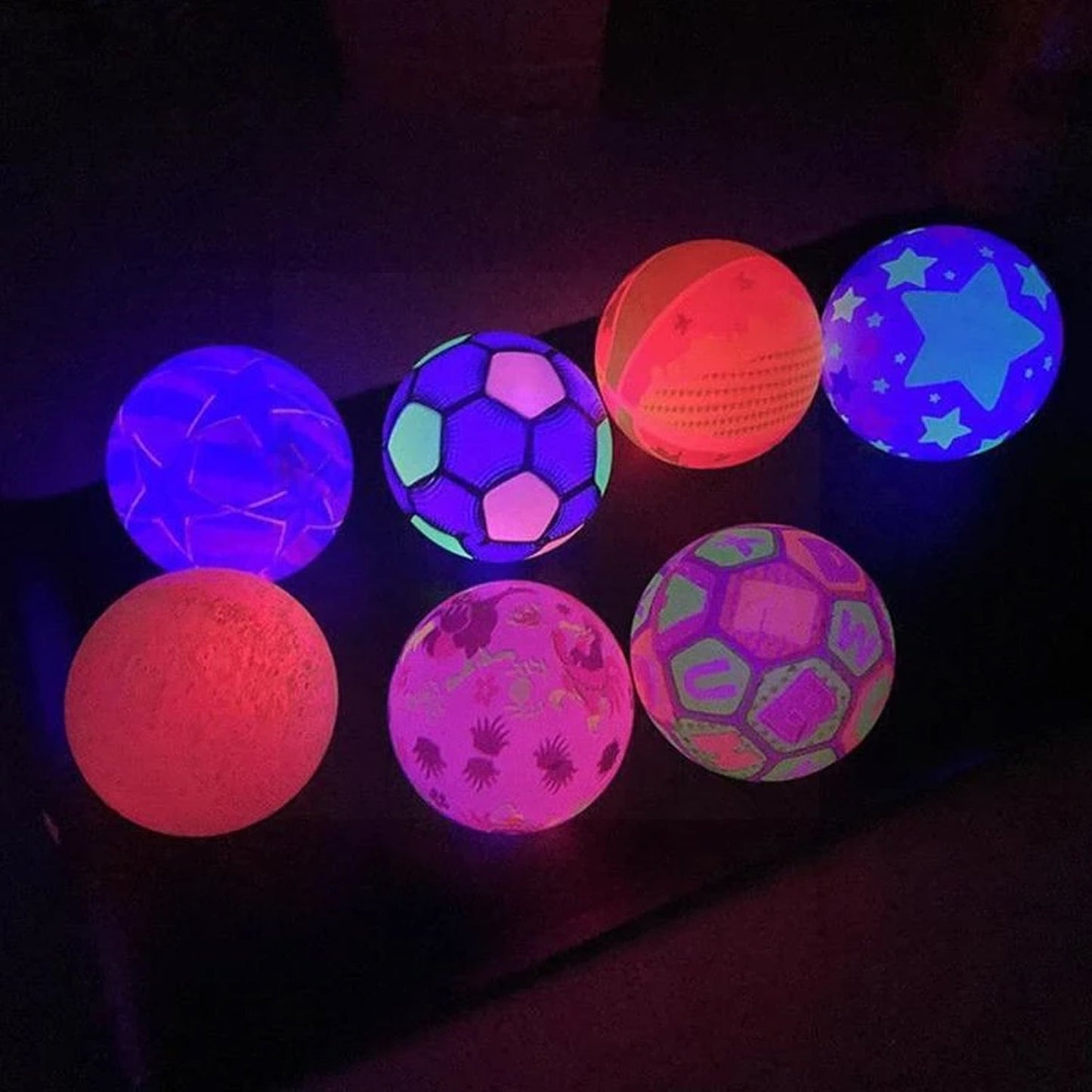 Close-up view of the bouncy LED ball, emphasizing its rubber material and colorful design