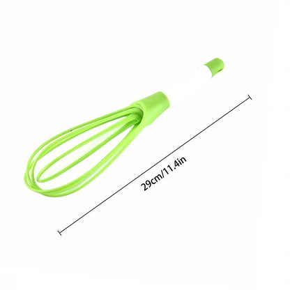 Durable plastic balloon whisk for mixing milk, coffee, eggs, and juice.