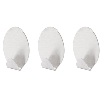 Self-adhesive wall hooks, pack of 3, strong hold.