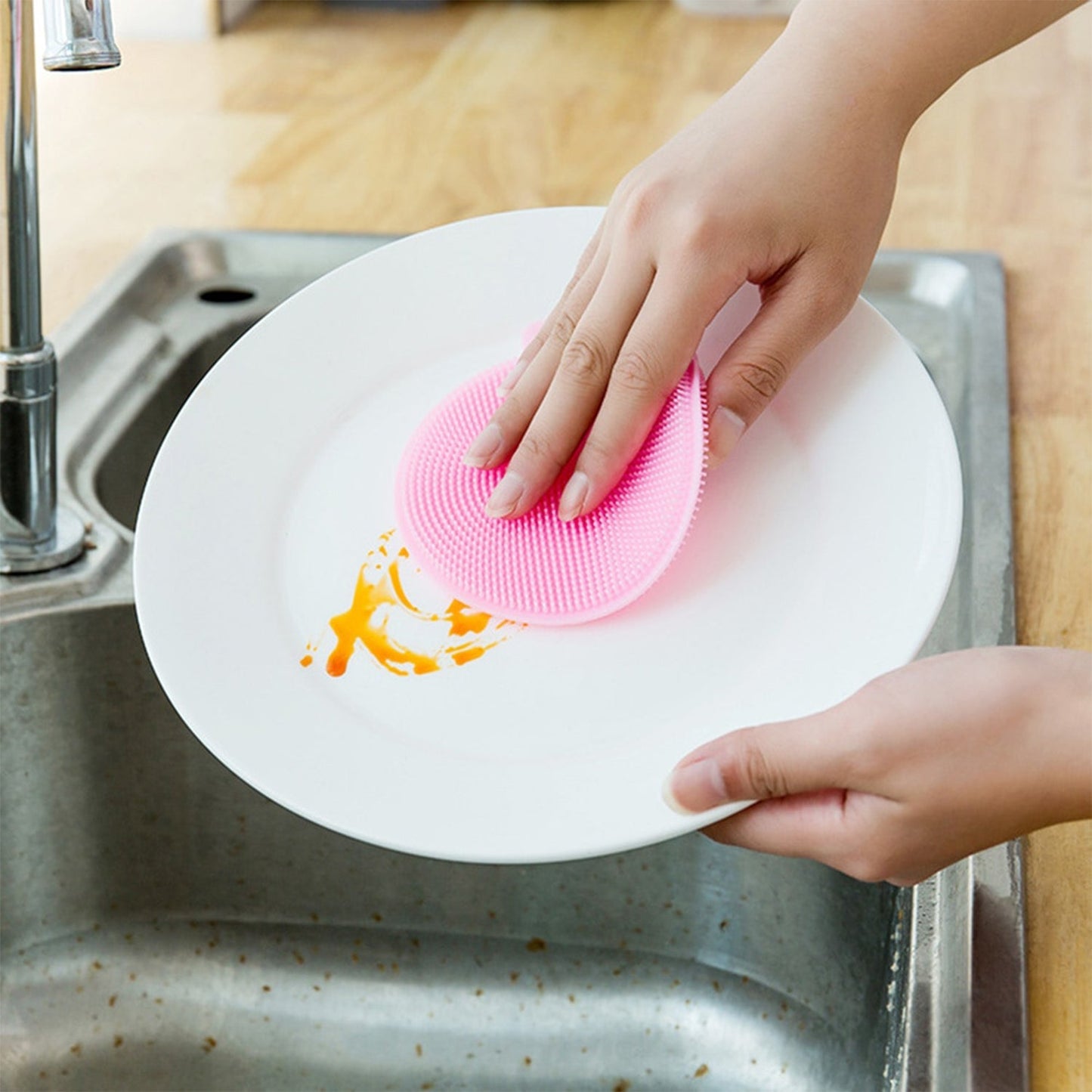 Mildew-free silicone dish sponge in assorted colors for easy scrubbing.