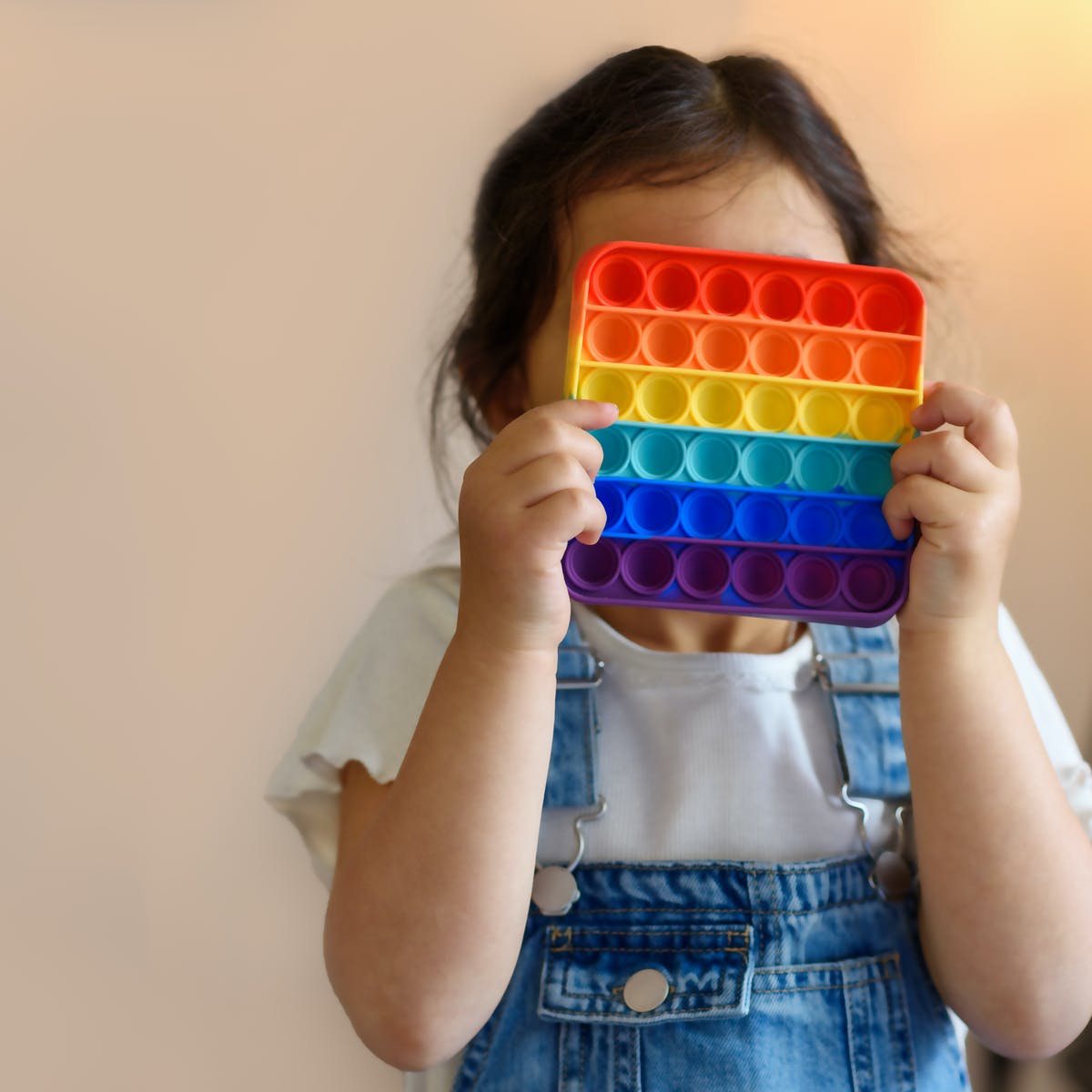 Rainbow pop bubble fidget toy designed for sensory play